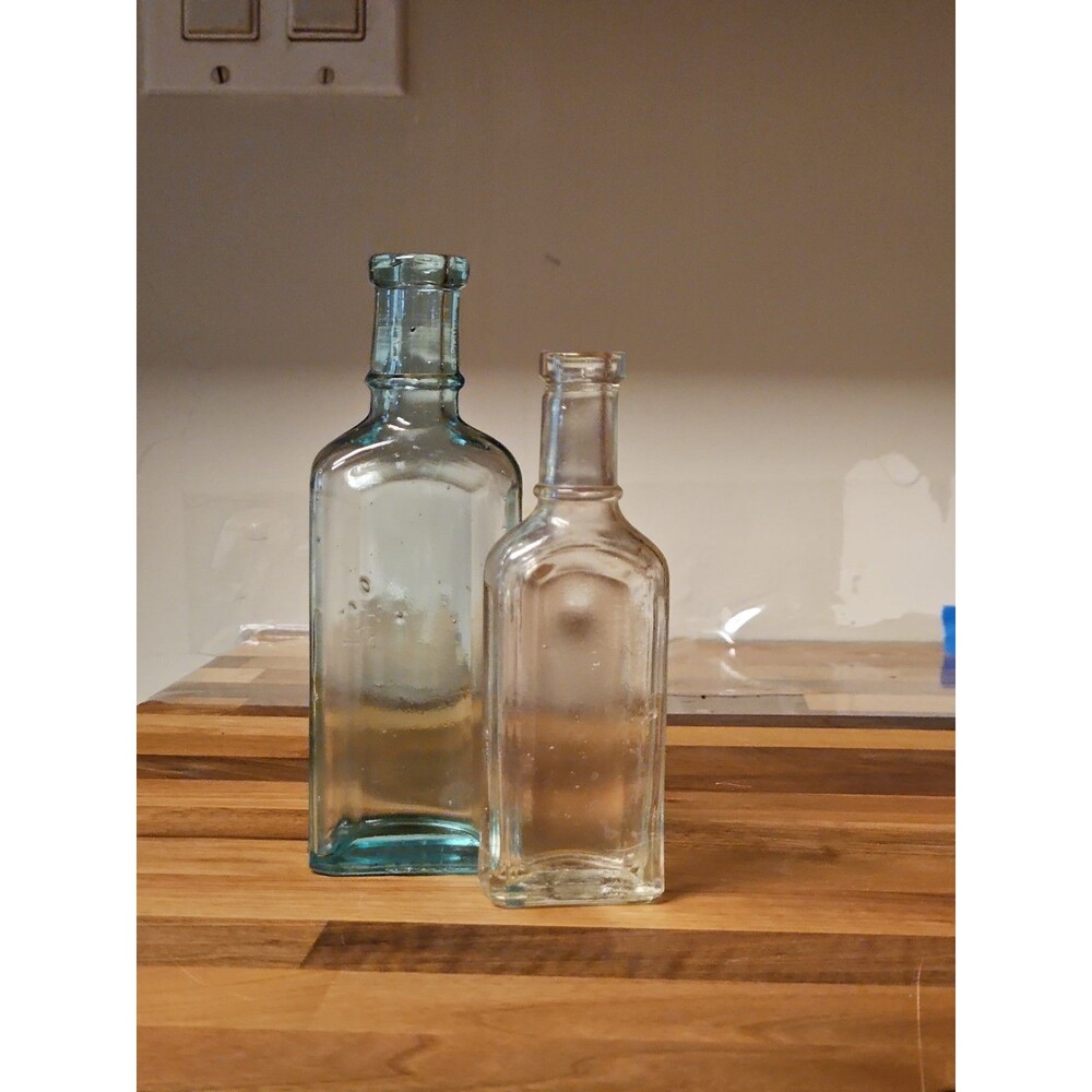 Set Of 2 Antique Medicine Bottles 5.5" & 4.75" Clear Aqua & Grey EUC